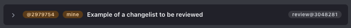A shelved changelist card showing a review status badge.